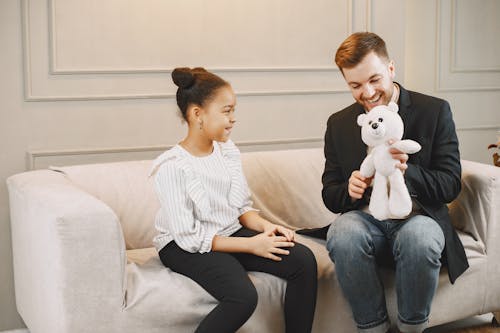 Father and Daughter with Toy