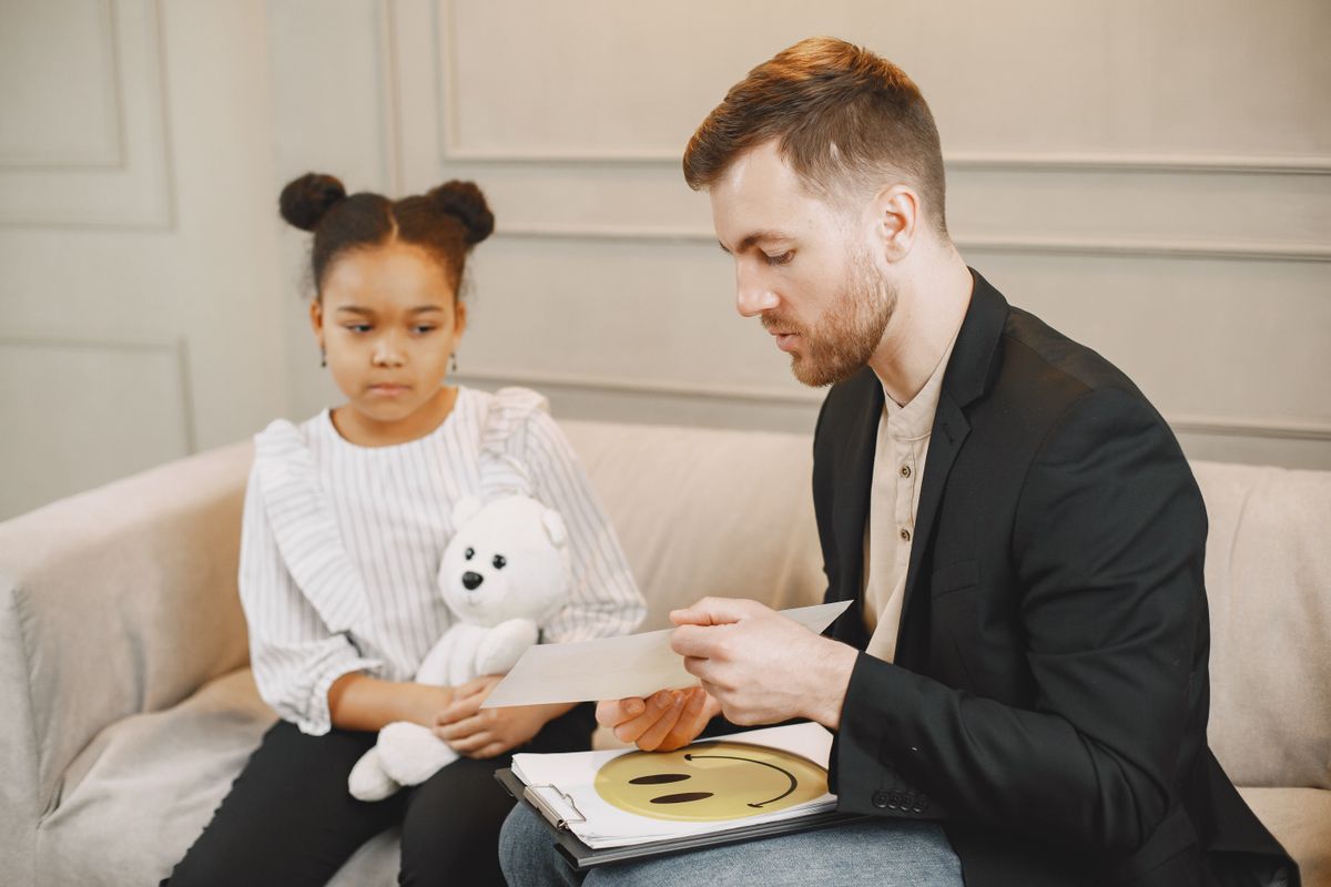 Behavior technician working one-on-one with a young child