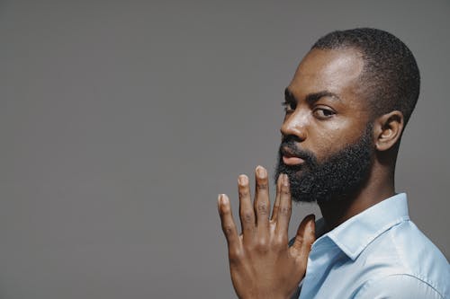 Portrait of Man Touching Chin with Fingers