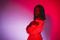 Portrait of Beautiful Woman Posing in Red Lights