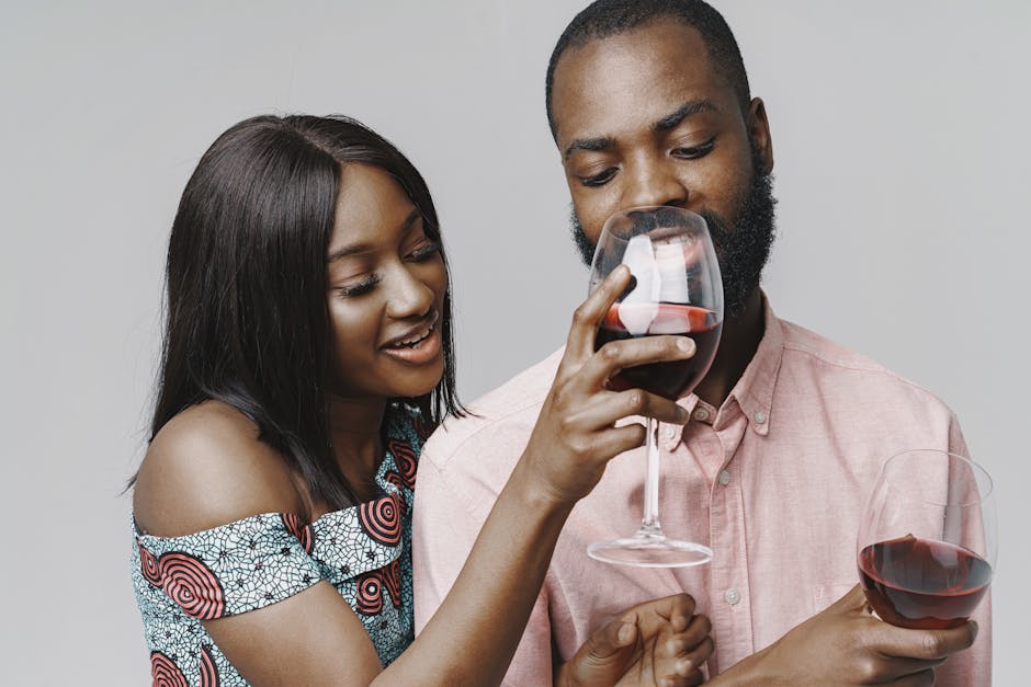 Woman Giving Man Taste of her Wine