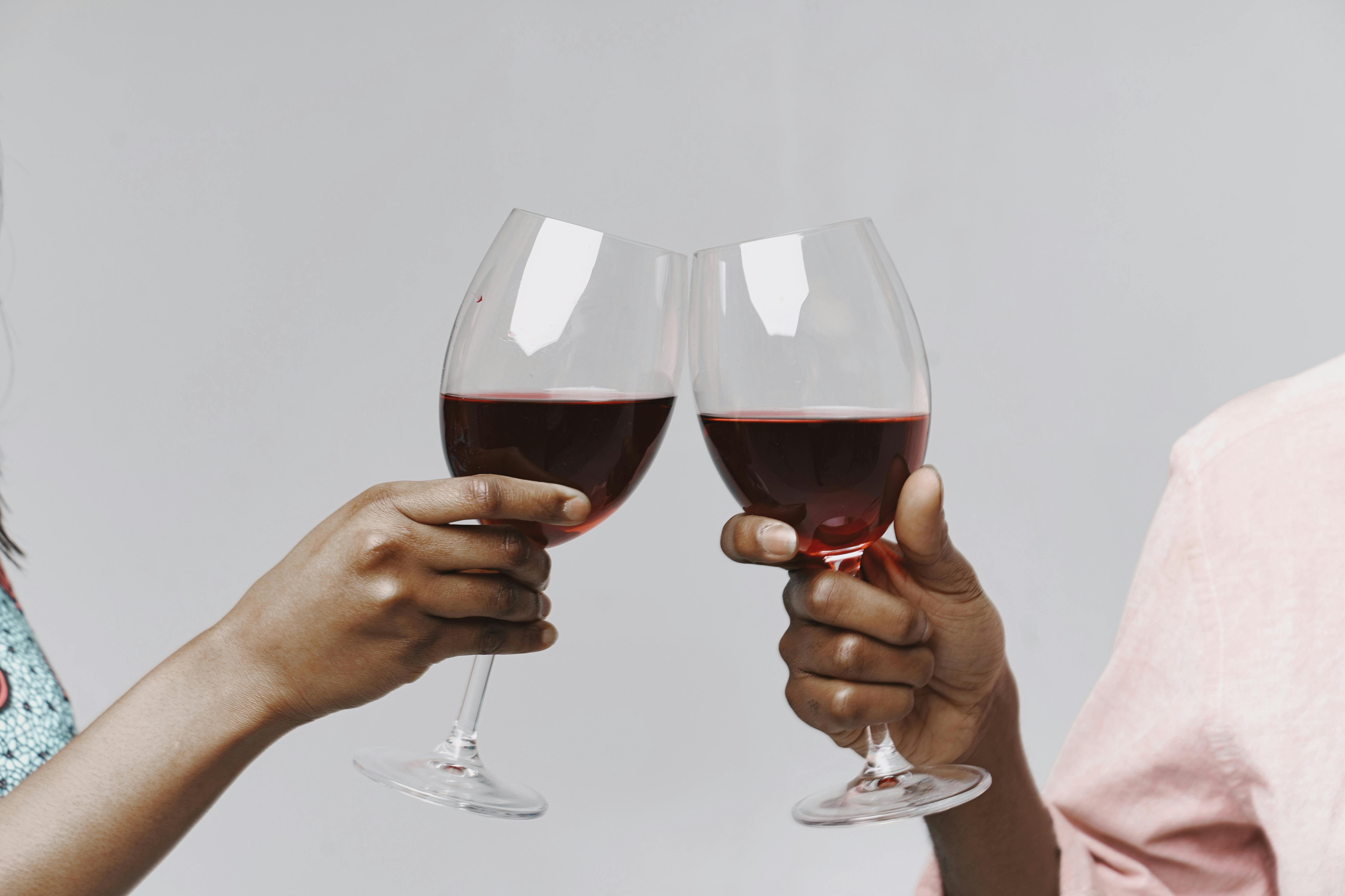 2 Person Holding Wine Glasses · Free Stock Photo