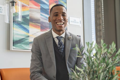 A Man in Business Suit Smiling
