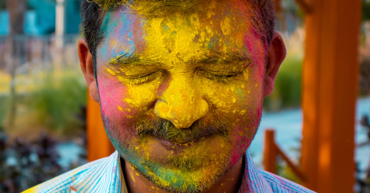 A Man with Colored Powder on His Face · Free Stock Photo