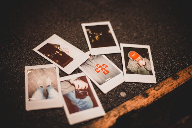 Instant Photos Placed On Gray Surface