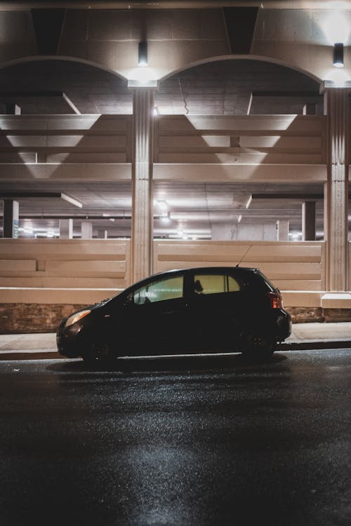 Free Car parked on street near building Stock Photo