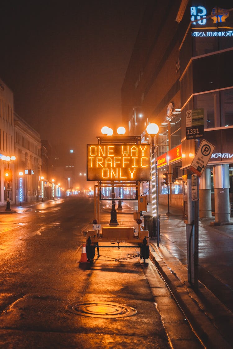 Electronic Traffic Sign With Inscriptions Placed On Roadway On Street In City