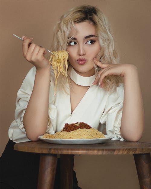 A Woman Eating a Spaghetti
