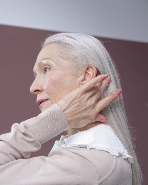 Free Elderly Woman Touching Her Hair Stock Photo