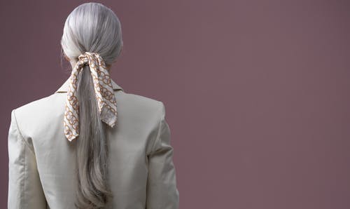 Back View of a Woman with Tied Scarf on Hair