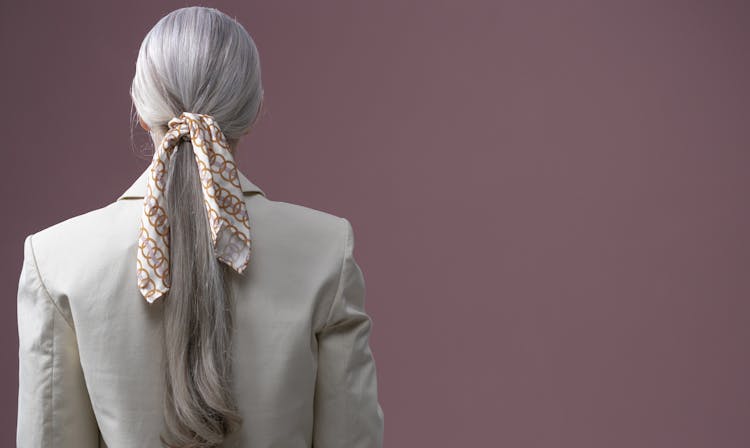 Back View Of A Woman With Tied Scarf On Hair