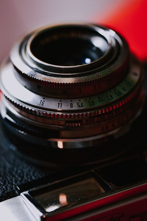 Free Detailed view of a vintage camera lens with aperture settings. Stock Photo
