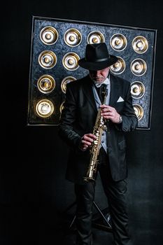 Jazz musician playing saxophone in stylish suit with vibrant spotlight backdrop.