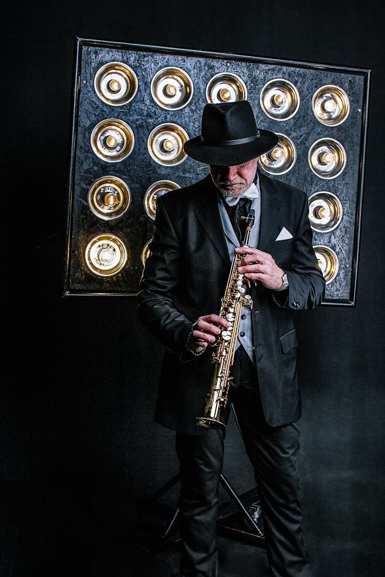 Old Man In Suit Playing Jazz Instrument