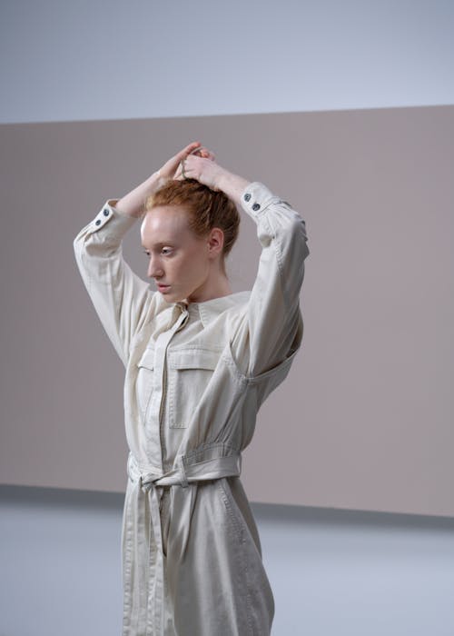 Close-Up Shot of Woman Tying Her Hair