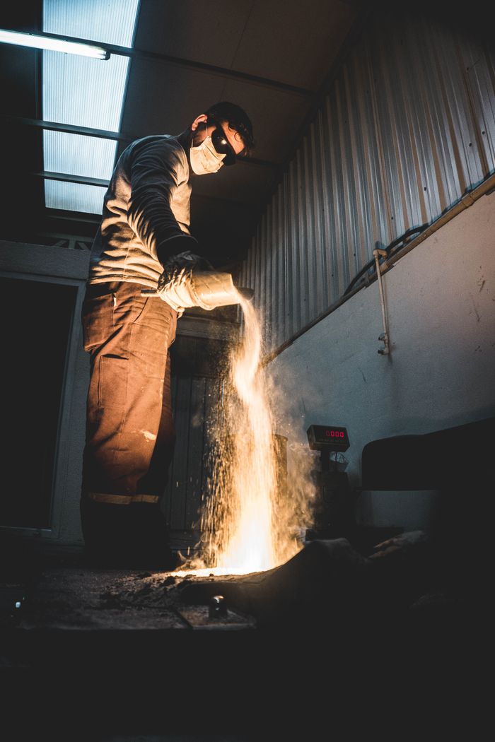 Furnace / process work — Industrial worker using protective equipment against heat and flame hazards