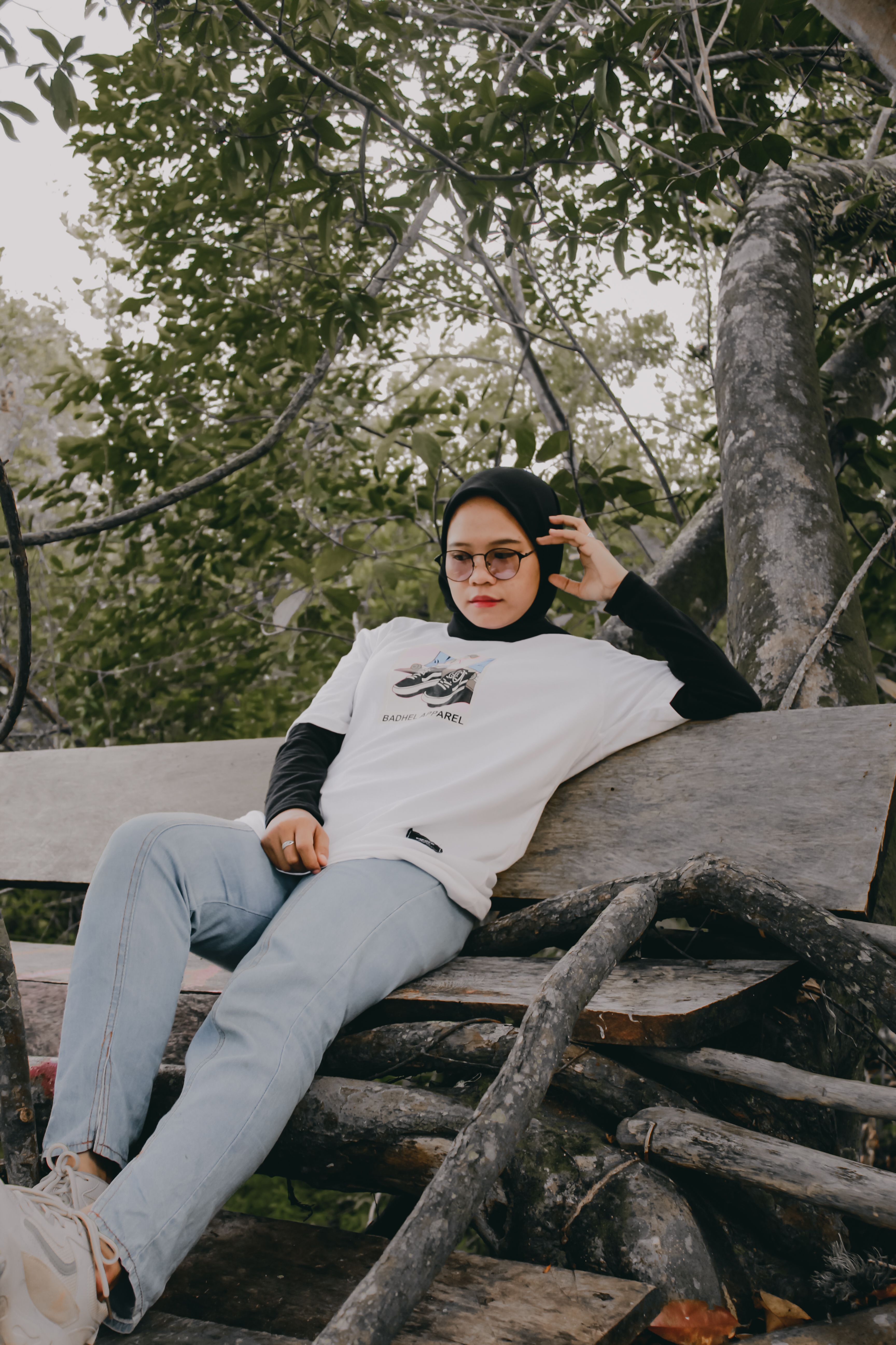 A Woman in White Hijab Sitting on the Chair while Laughing · Free Stock ...