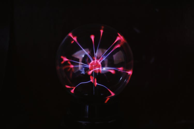 Plasma Ball With Bright Electric Light In Darkness