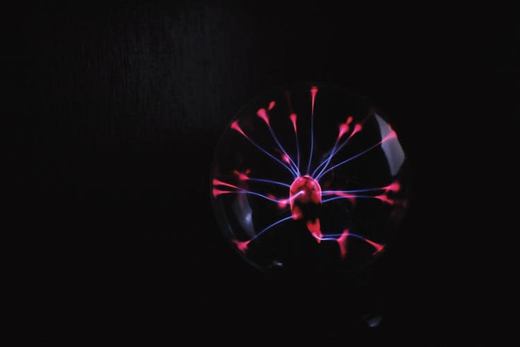 Shiny Plasma Ball Against Dark Background