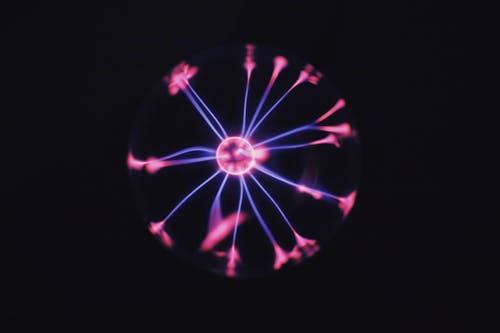 Neon light of plasma ball in darkness