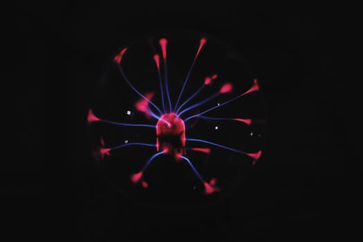 Bright glowing plasma ball with mystic colorful neon luminous placed in dark room