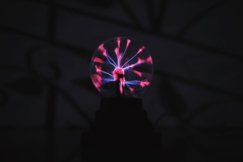 Free Round plasma ball with bright light in dark room Stock Photo