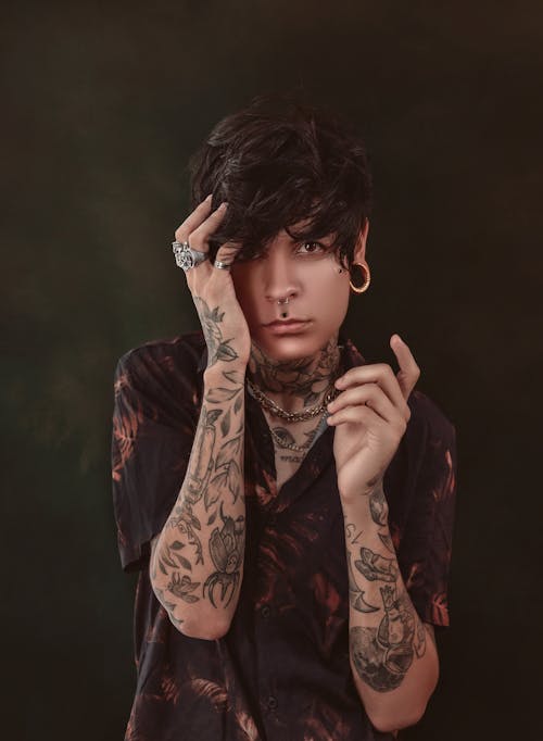 Free Androgynous male with tattoos and piercing Stock Photo