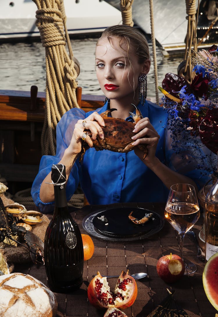 Stylish Woman With Crab On Boat