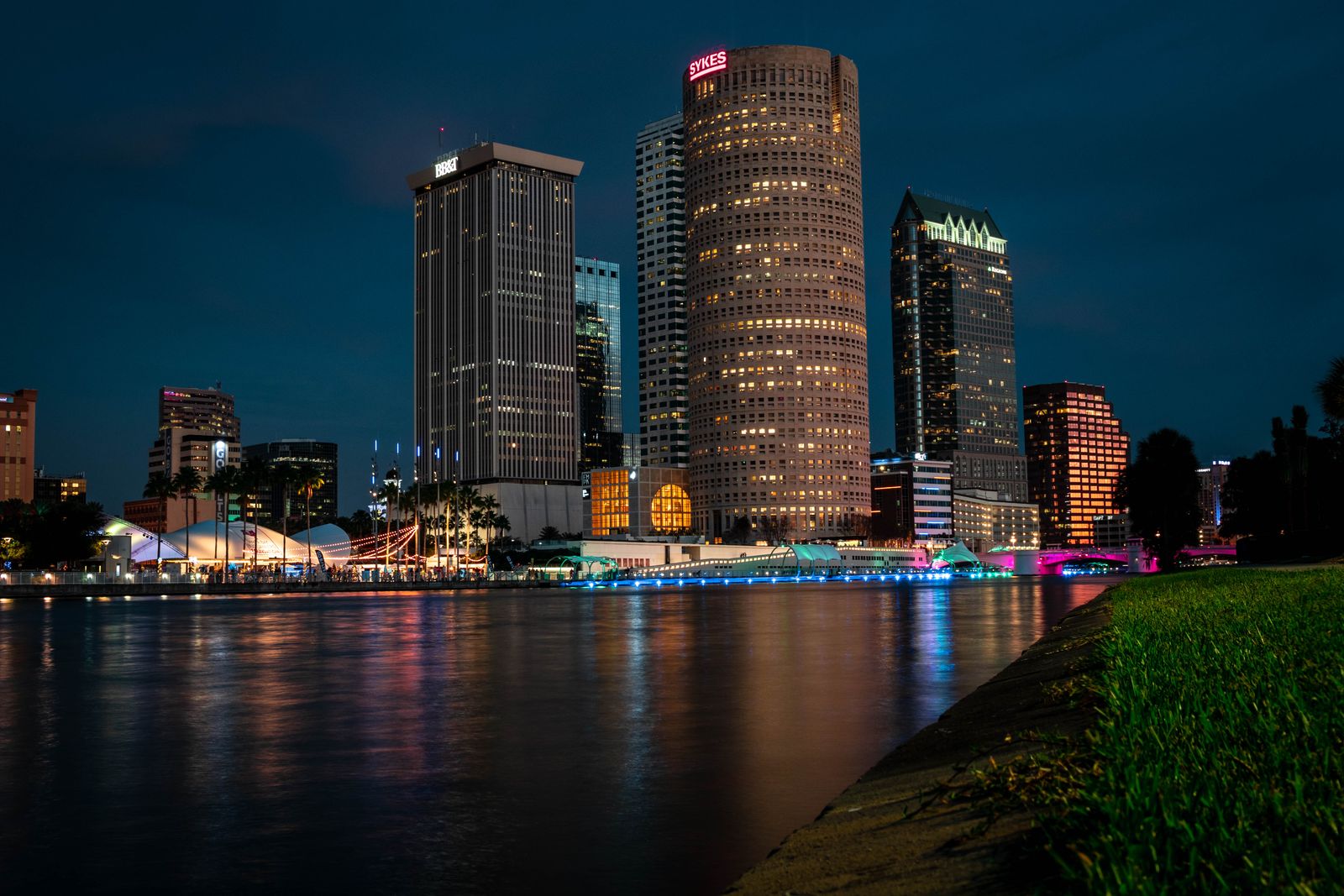 Downtown Tampa skyline reflected across the waterfront at night