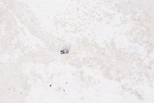Aerial Shot of SUV on Snow