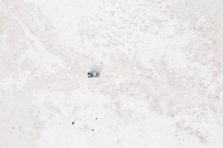 Aerial Shot Of SUV On Snow