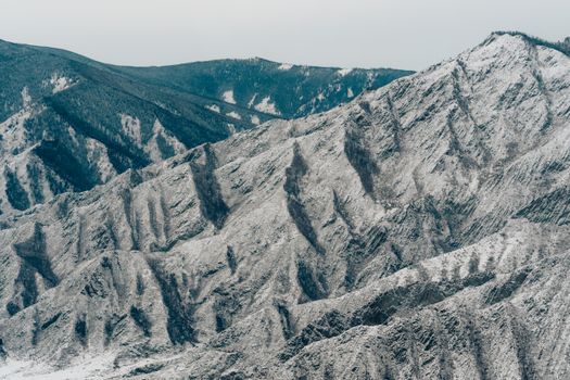 A breathtaking view of snow-covered mountains, showcasing the beauty of winter nature.