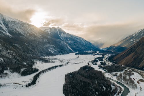 Snow Covered Ground Near Mountains