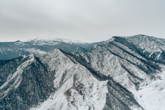 A stunning view of snow-covered mountains showcasing winter's serenity and majesty.