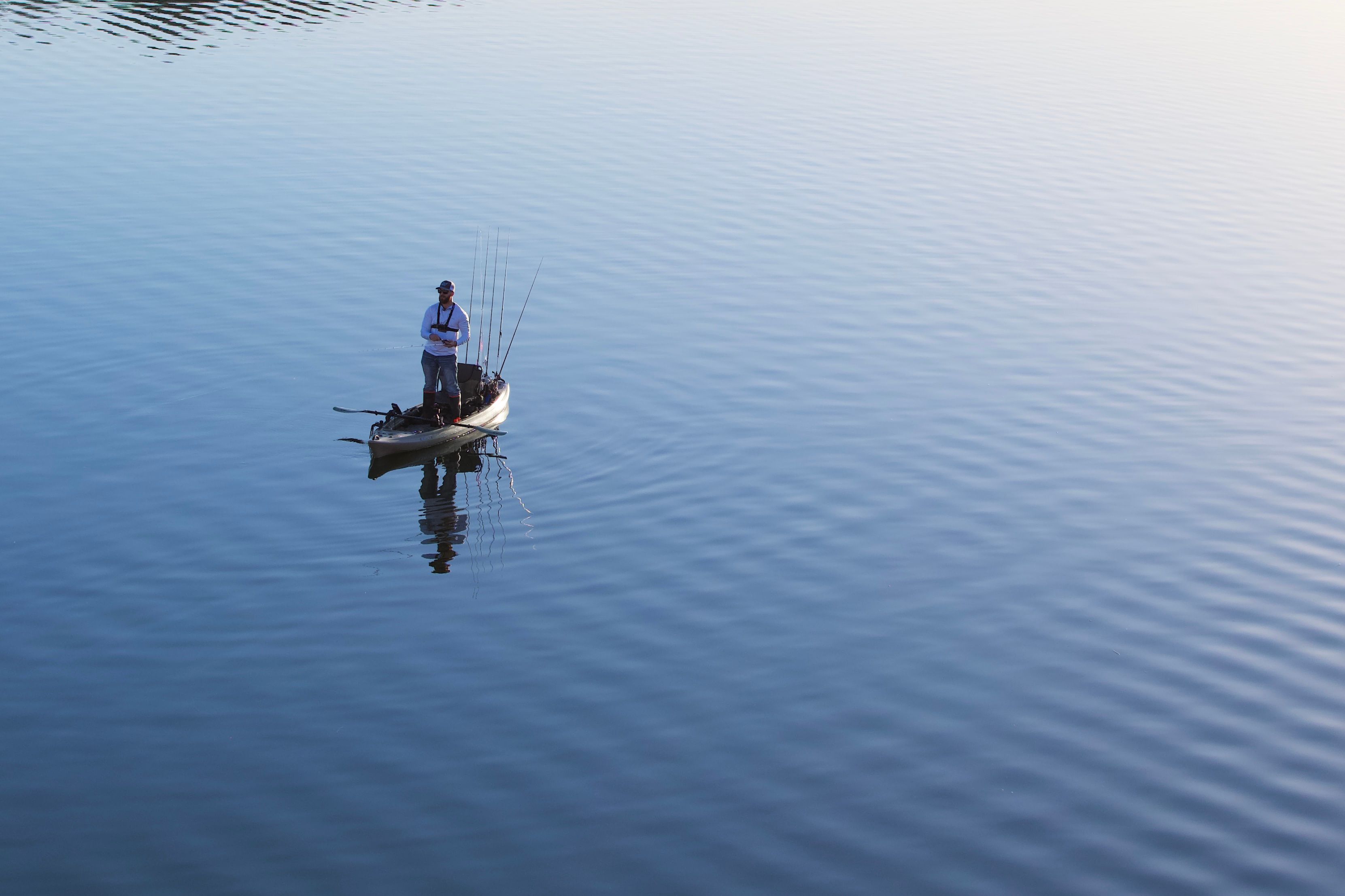 Person Standing on Boat · Free Stock Photo