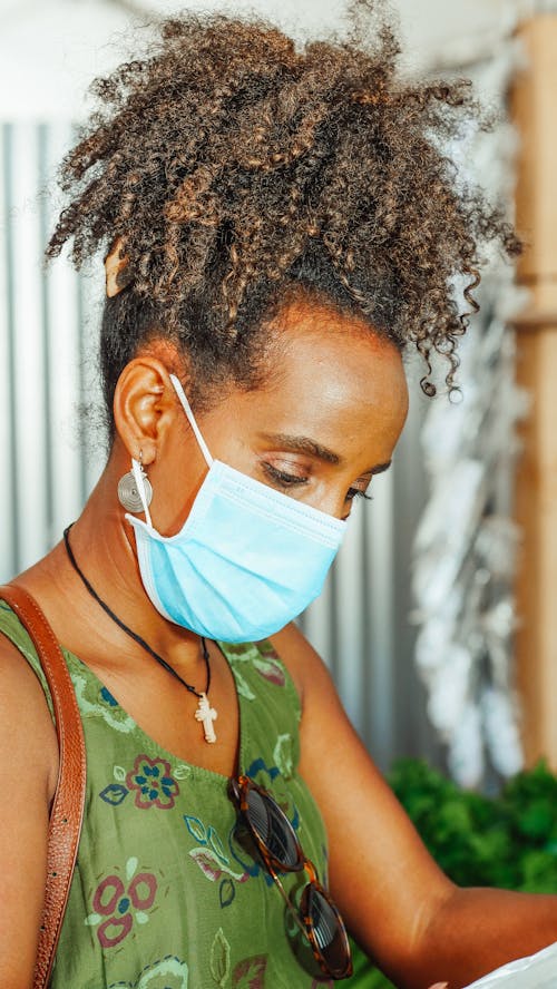 Free Curly Haired Woman Wearing Surgical Face Mask  Stock Photo