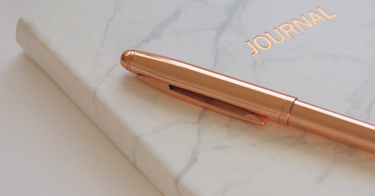 Gold Pen on Journal Book
