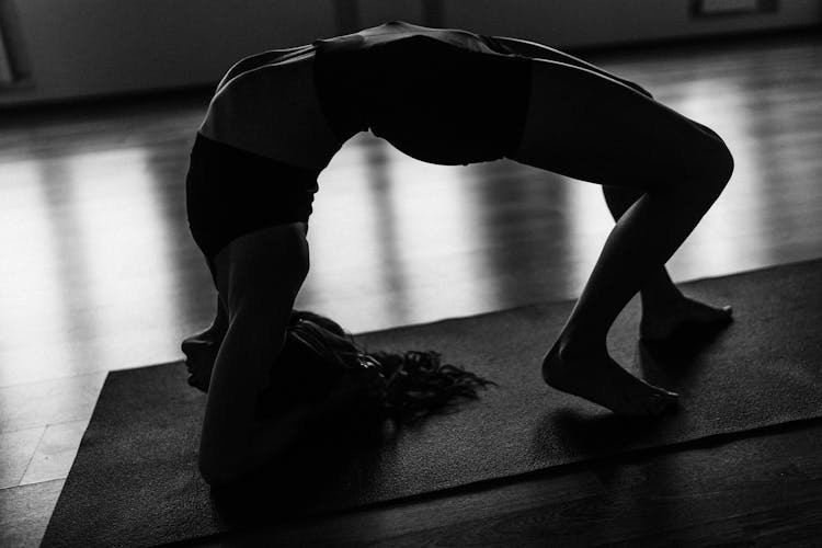 Woman Preparing For Inverted Staff Posture