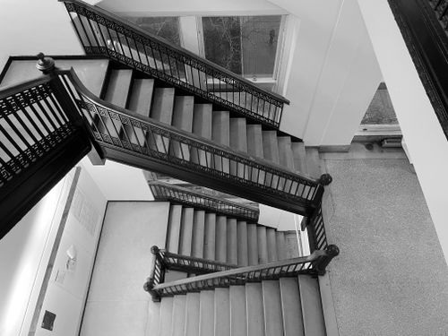 Free Monochrome view of an elegant staircase showcasing classic architectural design. Stock Photo