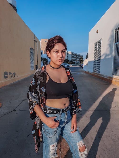 A Short-Haired Woman in Streetwear Looking at Camera 