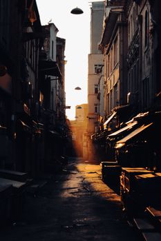 A beautifully lit narrow alley in Istanbul, Turkey, showcasing urban architecture at sunset.