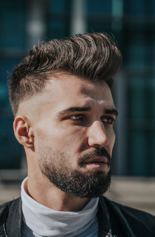 Photo of Man With Facial Hair and Trendy Hairstyle