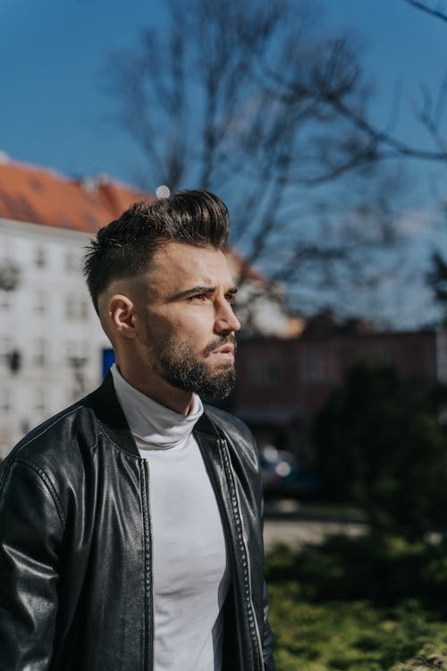 Free Man in Black Leather Jacket With Trendy Hairstyle Stock Photo