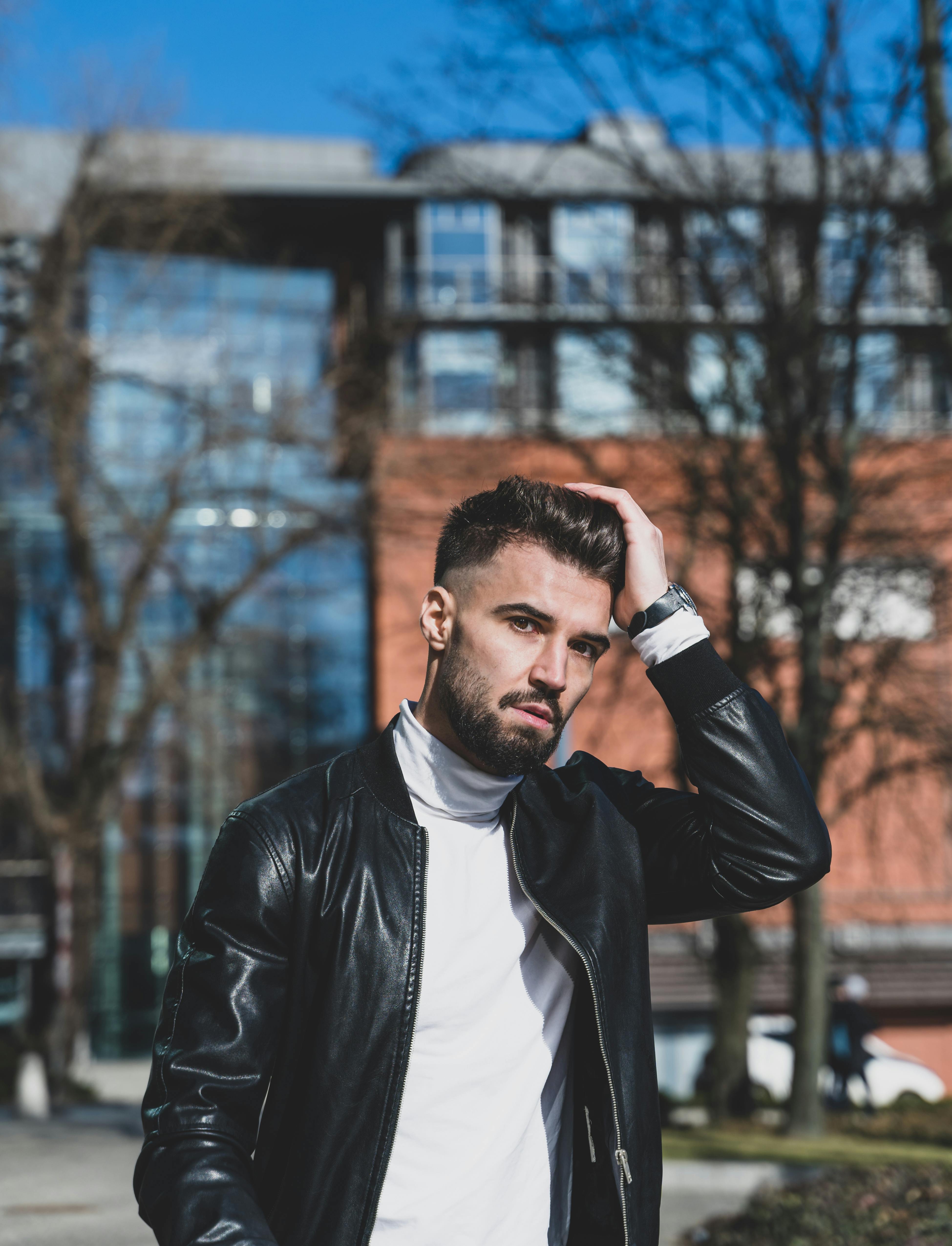 Man in Black Leather Jacket Holding His Hair · Free Stock Photo