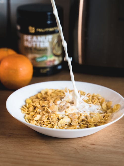 Free White Ceramic Bowl With Cereals and Milk Stock Photo