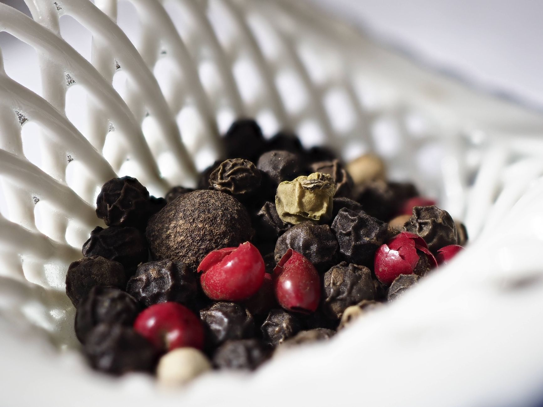Bourbon Peppercorn Glaze in a bowl with peppercorns