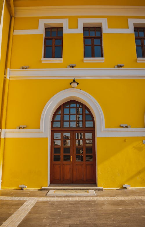 Arched Door Entrance to a Yellow Building