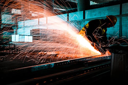 Free A Worker Cutting Metal Stock Photo