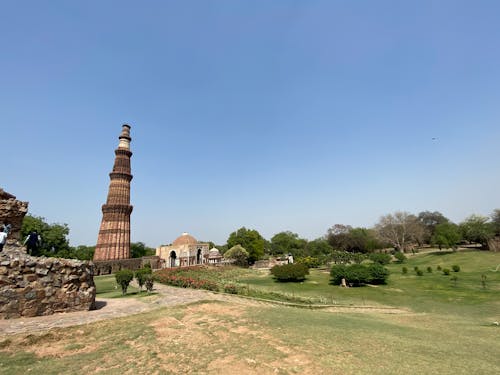 Brown Concrete Tower on the Grass Field