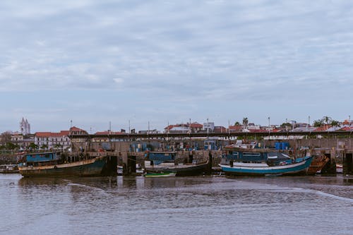 Fishing Boats at the Pier under the Sky
